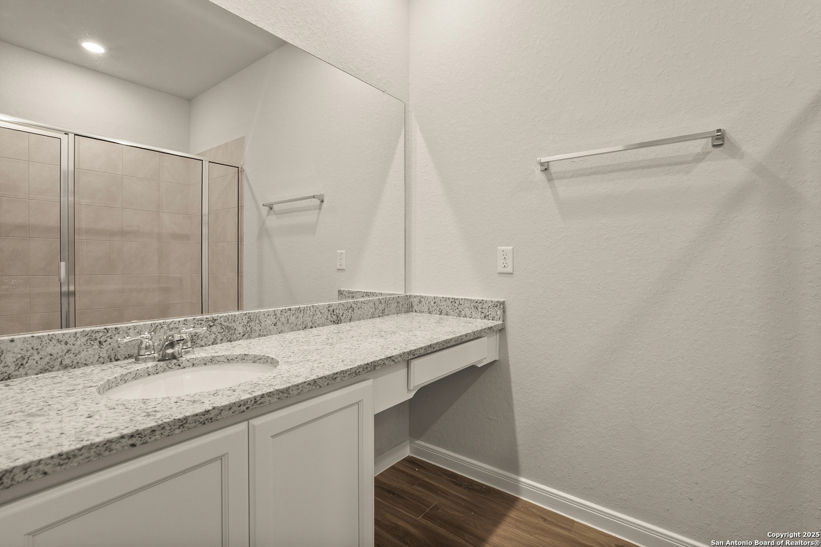 13624 Helton Pass St. Hedwig, TX 78152 - Photo 14 of 35 a bathroom with a granite countertop sink and a mirror