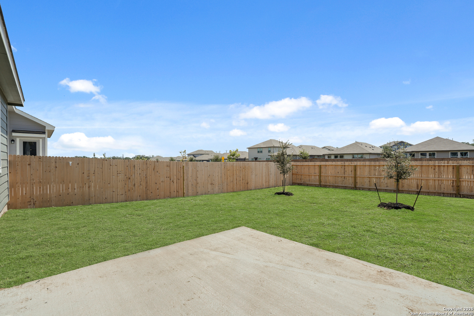 13624 Helton Pass St. Hedwig, TX 78152 - Photo 24 of 35 a view of a backyard with a lake view