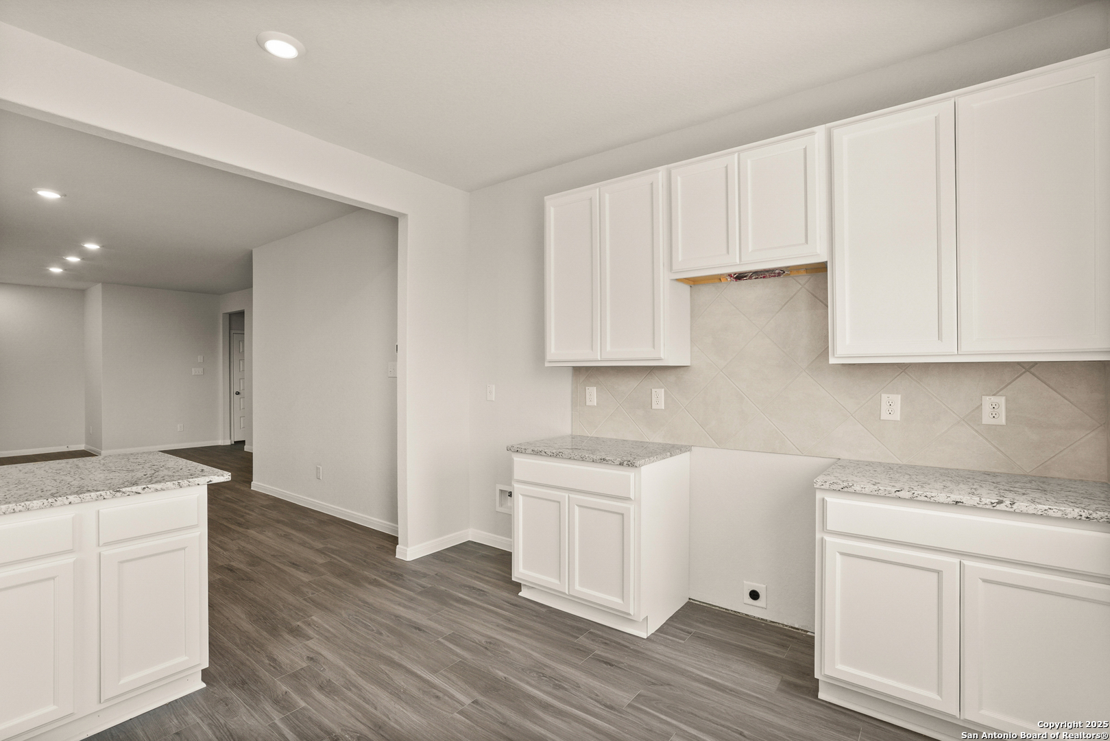 13624 Helton Pass St. Hedwig, TX 78152 - Photo 6 of 35 a kitchen with white cabinets appliances and sink