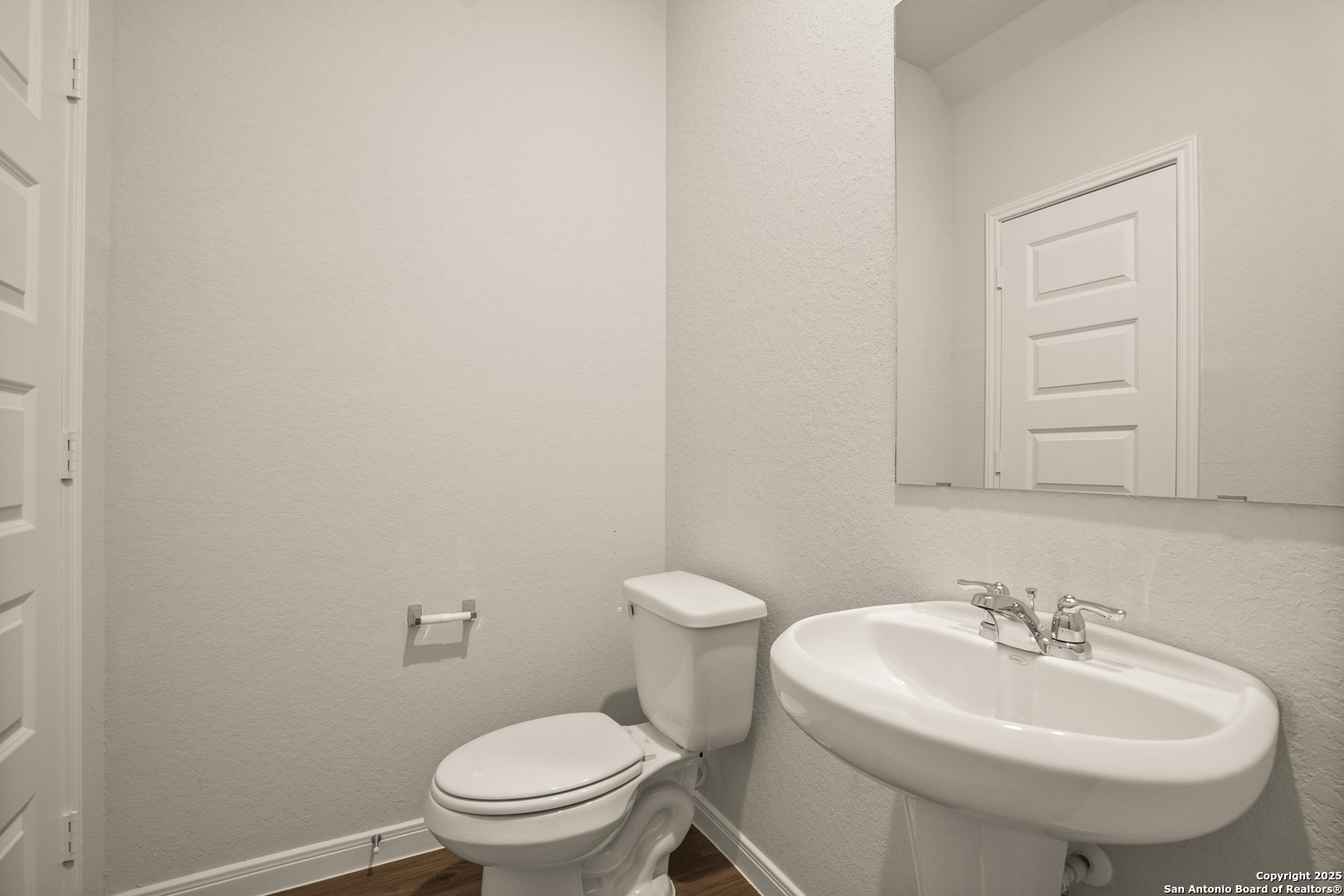 13624 Helton Pass St. Hedwig, TX 78152 - Photo 8 of 35 a bathroom with a sink a toilet and mirror