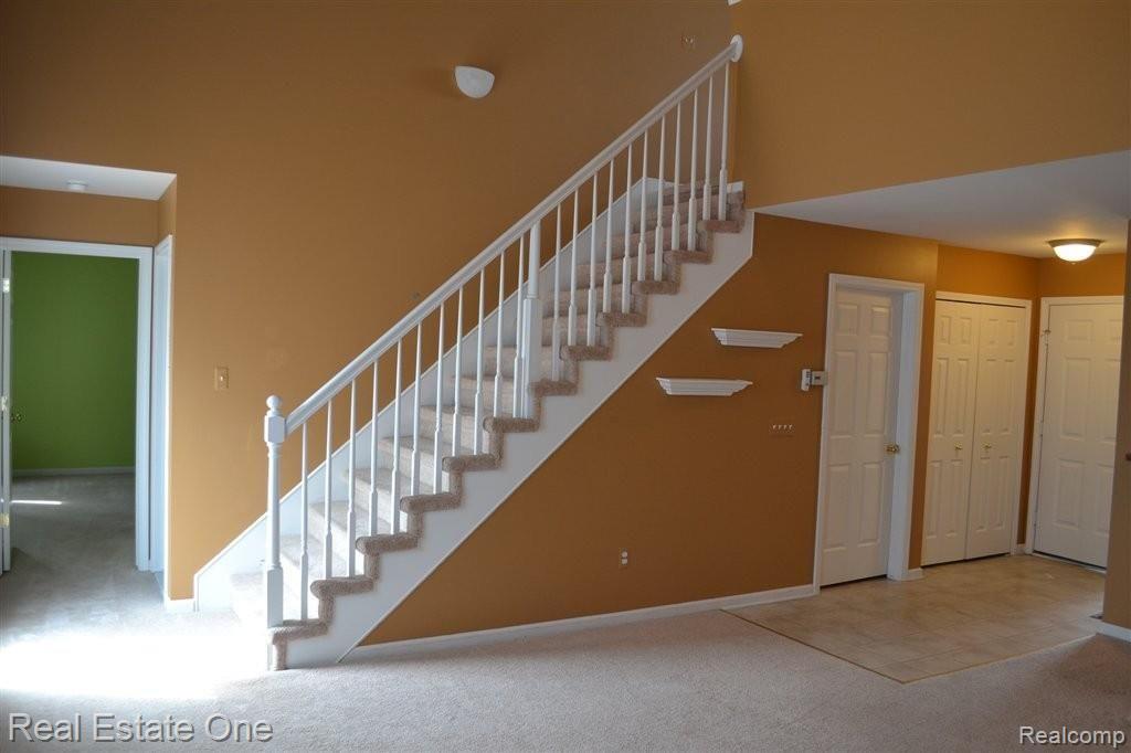 45586 Rathmore Drive, Unit 276 Macomb, MI 48044 - Photo 11 of 25 Stairs to second bedroom
