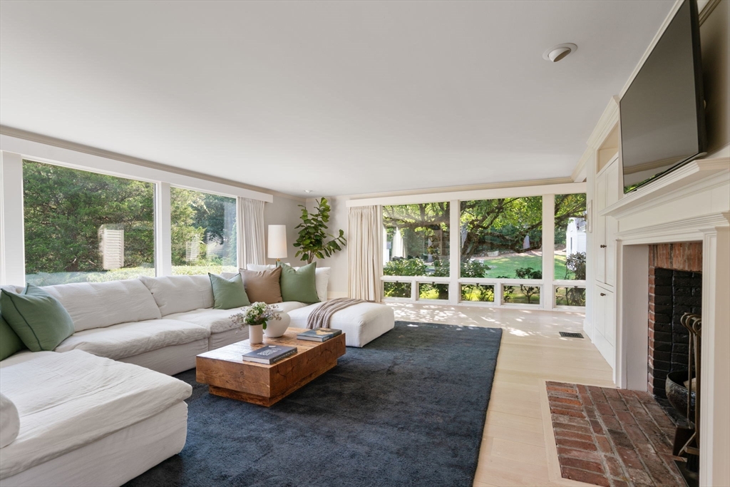 339 Pope Road Concord, MA 01742 - Photo 11 of 40 a living room with furniture and a flat screen tv