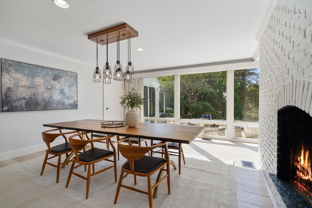339 Pope Road Concord, MA 01742 - Photo 13 of 40 a dining room with furniture a chandelier and a rug