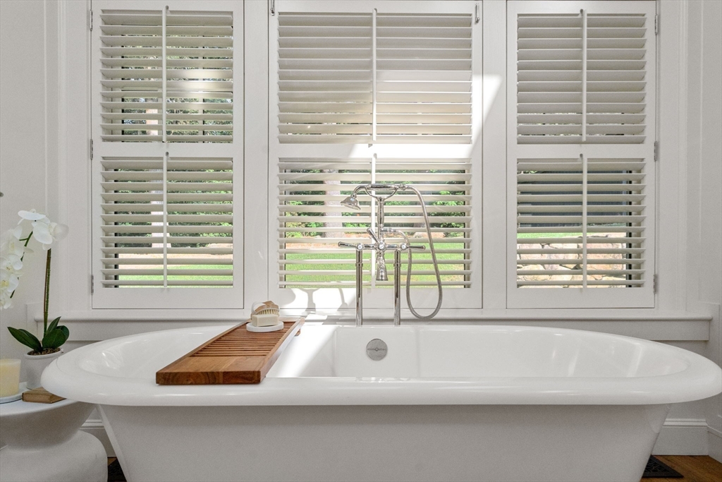 339 Pope Road Concord, MA 01742 - Photo 17 of 40 a bathroom with a bathtub and window