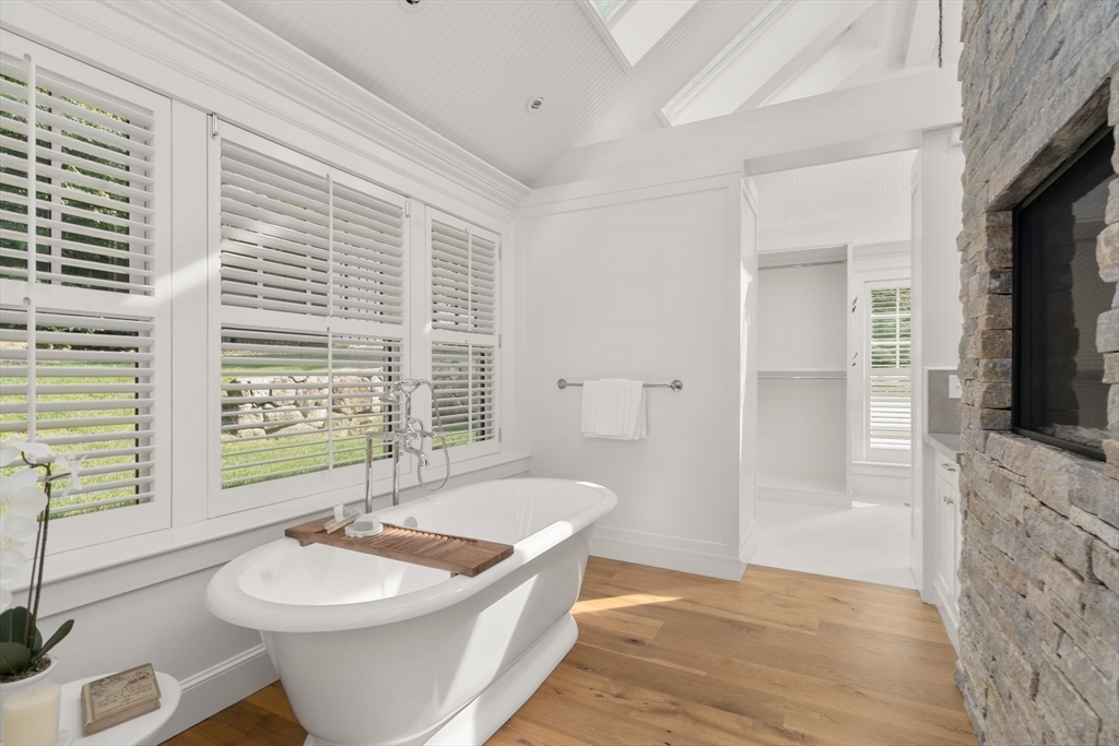 339 Pope Road Concord, MA 01742 - Photo 18 of 40 a spacious bathroom with a sink a bathtub and a window