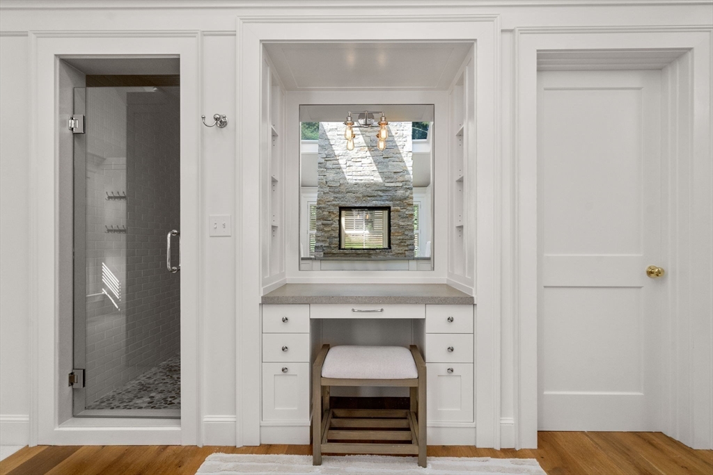 339 Pope Road Concord, MA 01742 - Photo 20 of 40 a view of kitchen and hallway with wooden floor