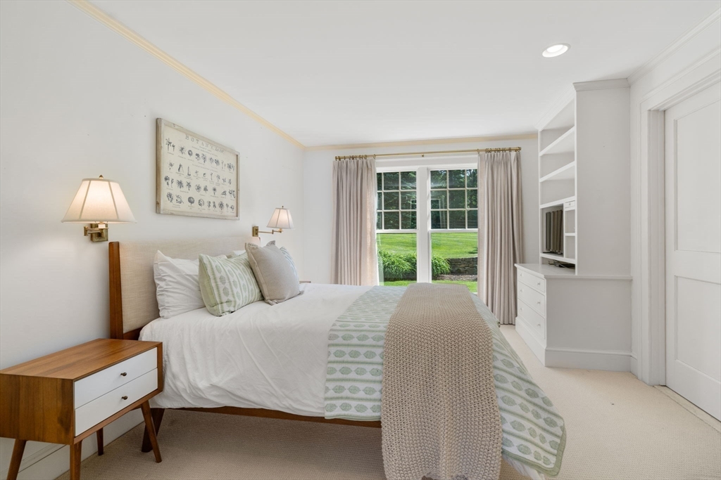 339 Pope Road Concord, MA 01742 - Photo 22 of 40 a bedroom with a bed and a window