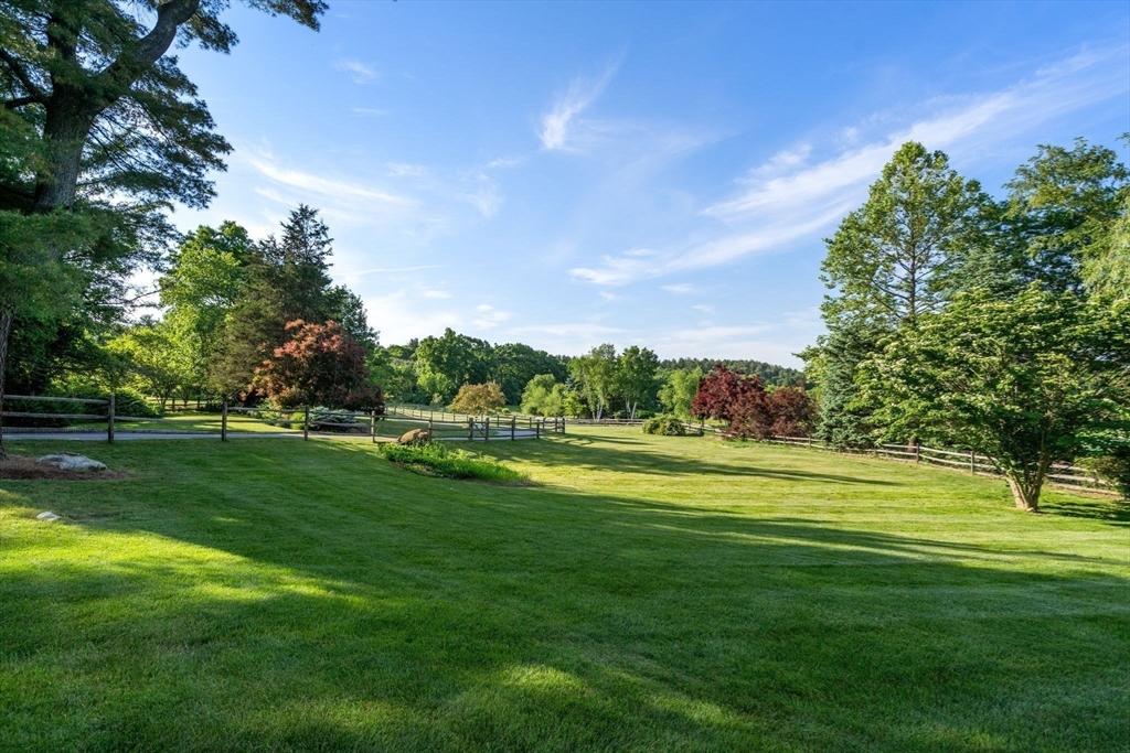 339 Pope Road Concord, MA 01742 - Photo 37 of 40 a view of a golf course with a lake