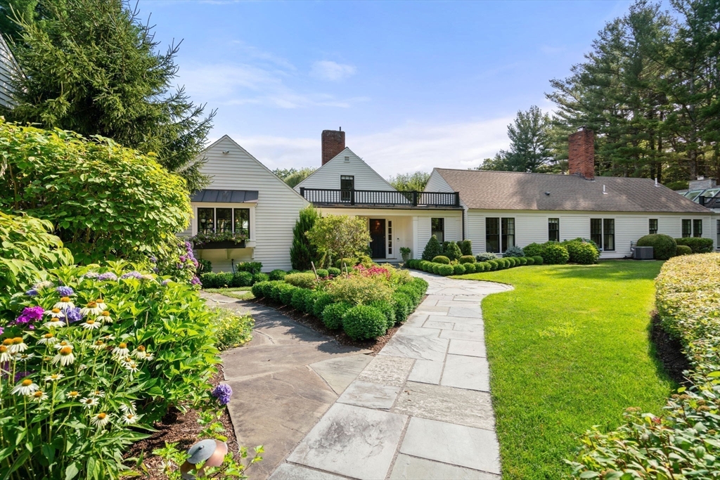 339 Pope Road Concord, MA 01742 - Photo 40 of 40 a front view of a house with garden