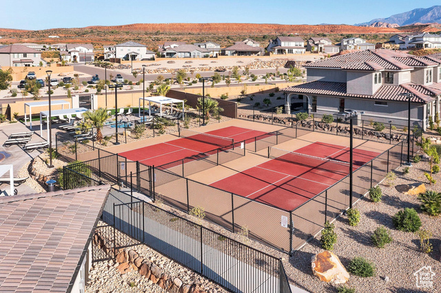1329 Paseos Street Washington, UT 84780 - Photo 32 of 35 View of tennis court featuring a residential view and a patio area