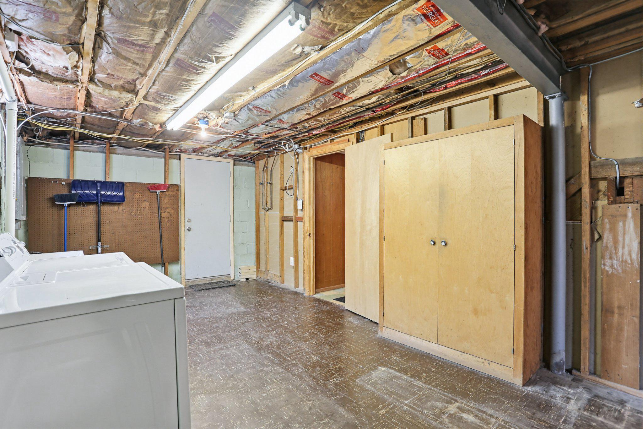 8145 Scotts Level Road Pikesville, MD 21208 - Photo 37 of 45 Laundry/storage area with exterior door to walk up