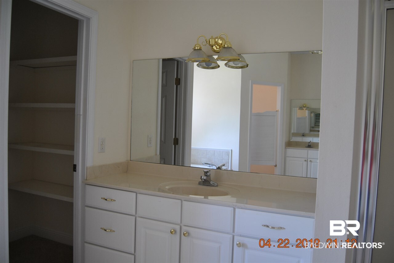411 Juniper Creek Road Brewton, AL 36426 - Photo 21 of 35 opposite side vanities and separate toilet area
