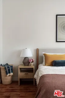 a bedroom with furniture and a window