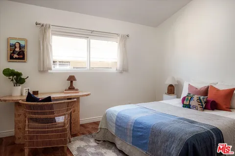 a bedroom with a bed and a table