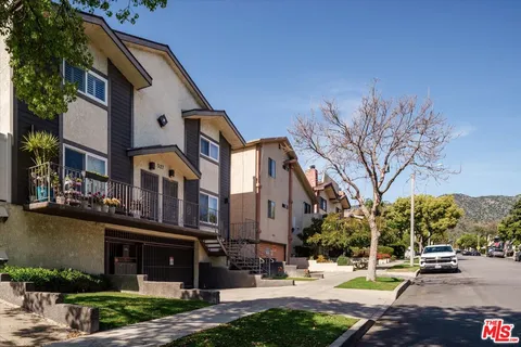 a view of a building with a street