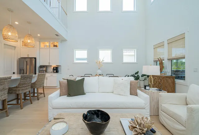 a bedroom with a bed and a flat tv screen on dresser