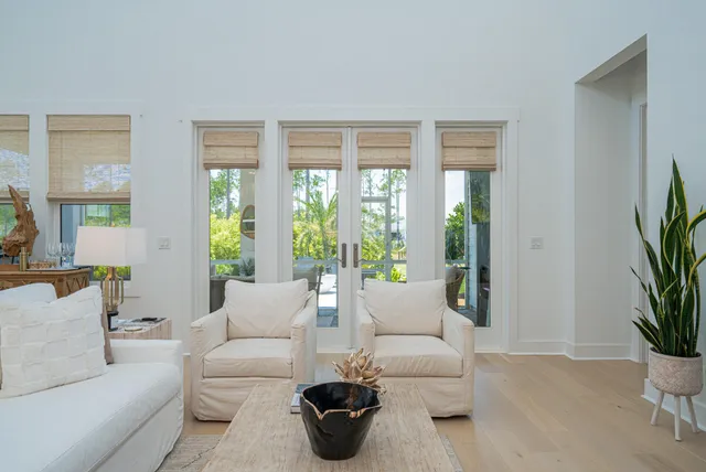 an aerial view of a house with a swimming pool outdoor seating and yard