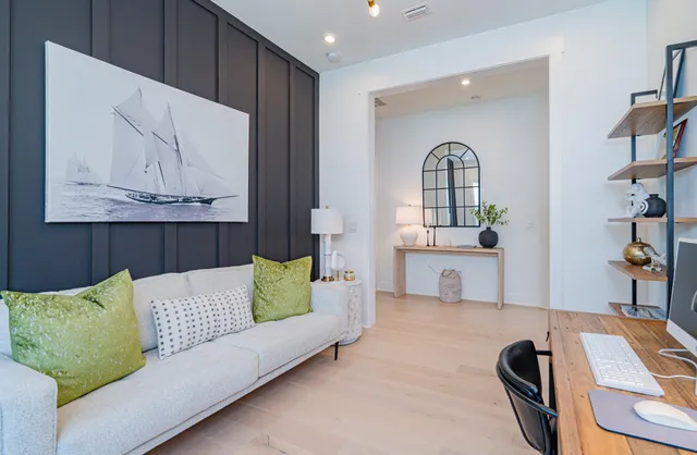 a bedroom with a bed chair and a window