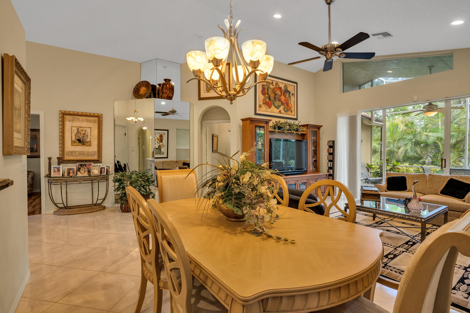 5153 Brookview Drive Boynton Beach, FL 33437 - Photo 17 of 44 a very nice looking dining room with a large window and chandelier