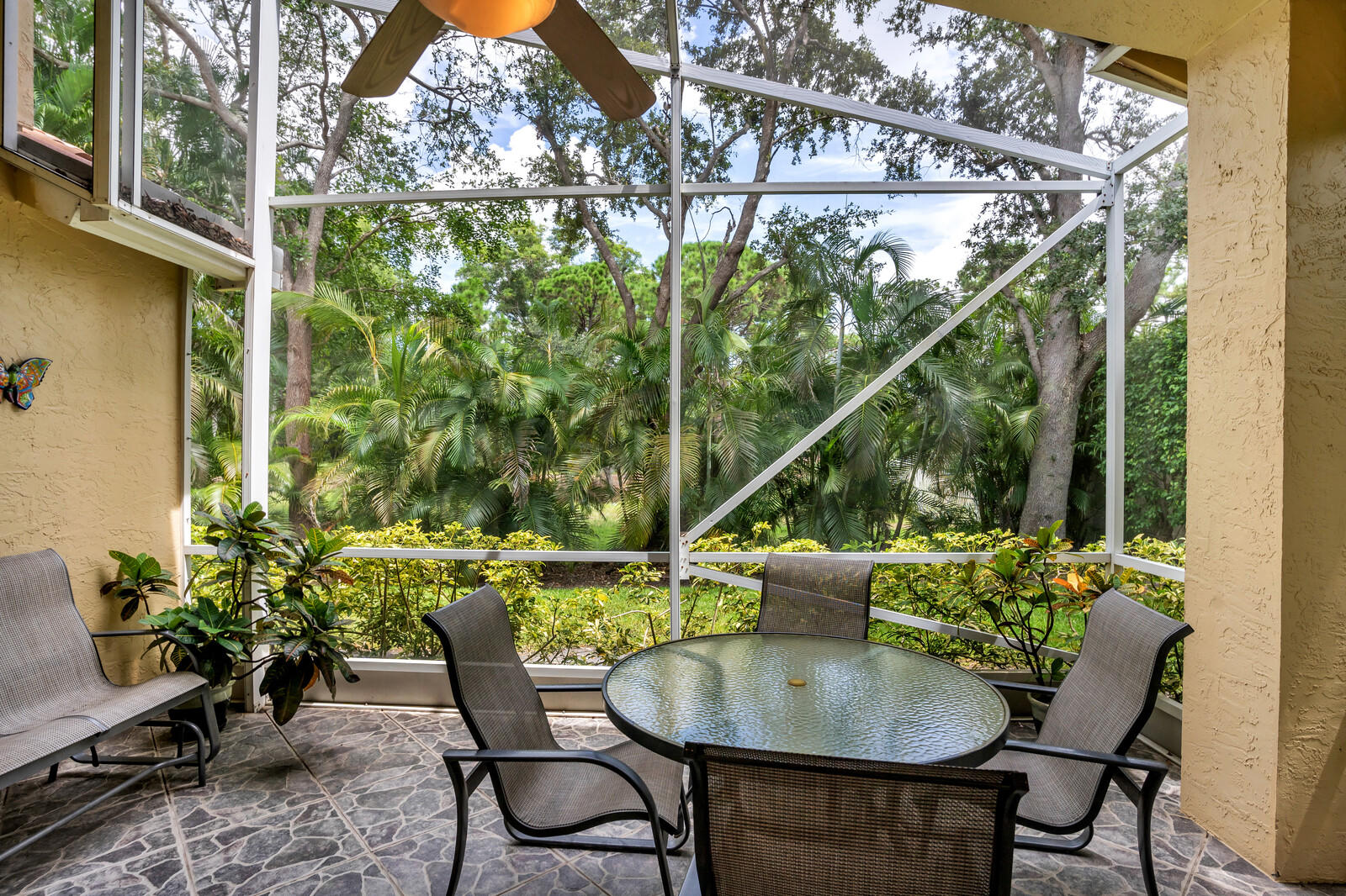 5153 Brookview Drive Boynton Beach, FL 33437 - Photo 33 of 44 a backyard of a house with table and chairs