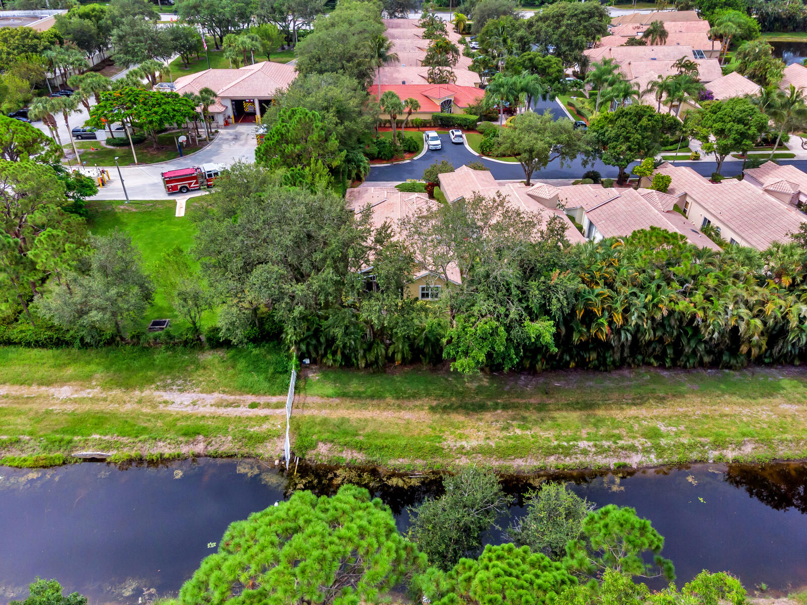 5153 Brookview Drive Boynton Beach, FL 33437 - Photo 41 of 44 a view of a lake with a house