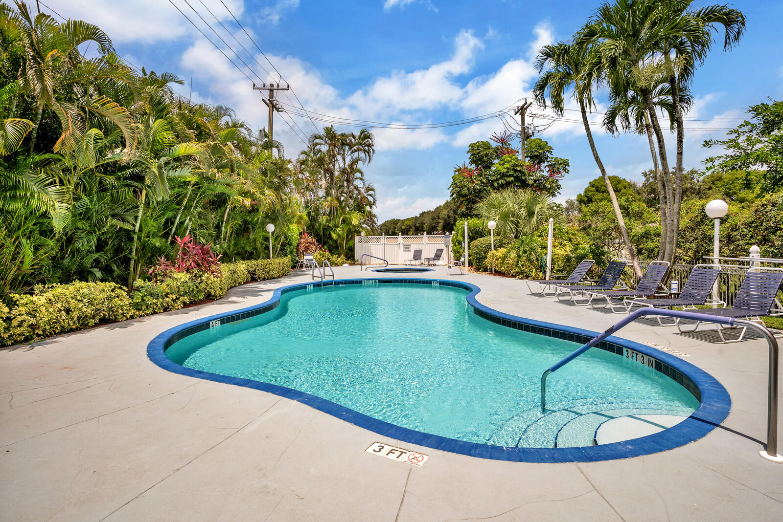 5153 Brookview Drive Boynton Beach, FL 33437 - Photo 42 of 44 a view of a swimming pool with a yard