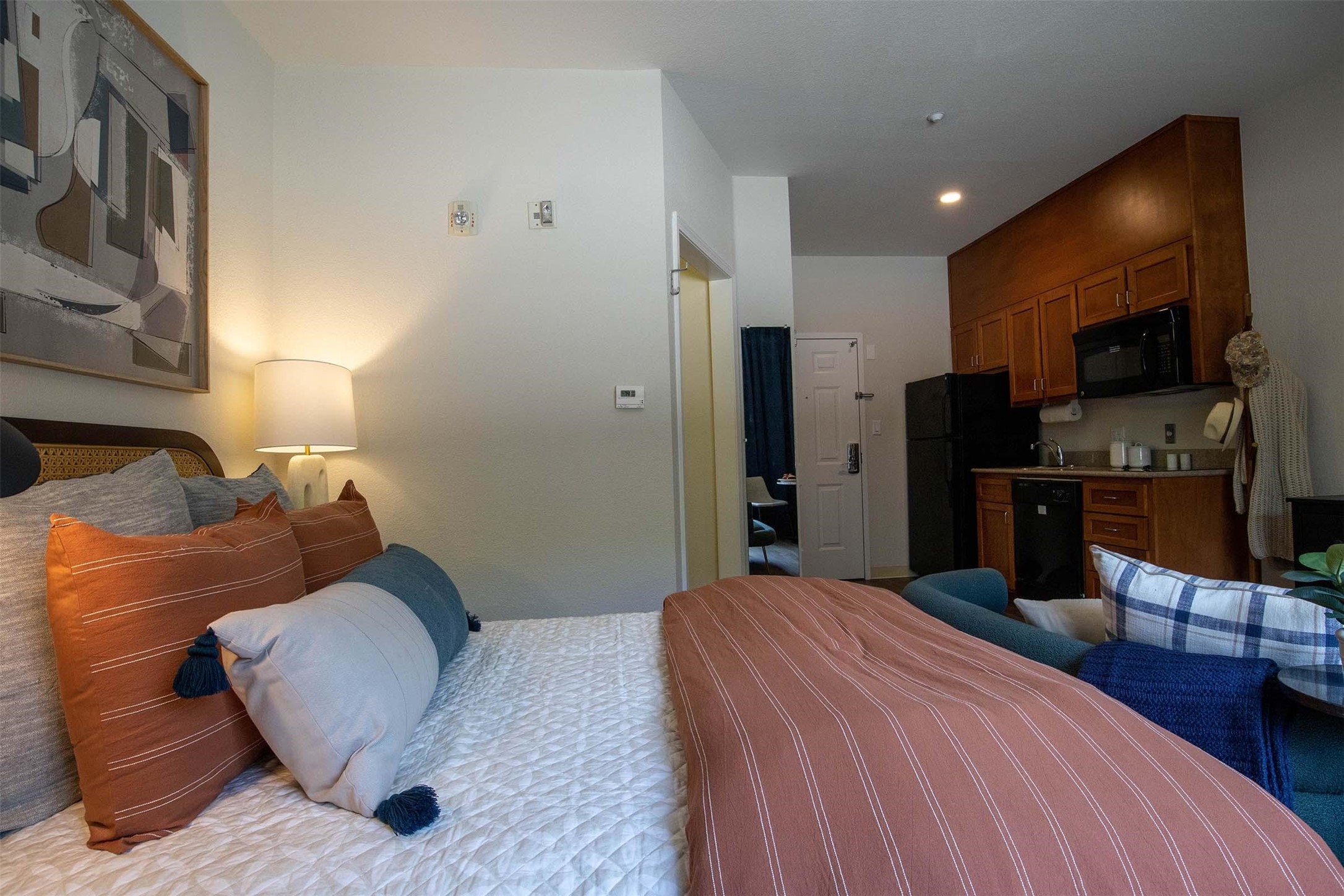 8719 Farm Market 1960 West Road, Unit 100 Houston, TX 77065 - Photo 24 of 50 a bedroom with a bed and furniture