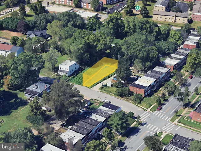an aerial view of a house with a swimming pool yard and outdoor seating