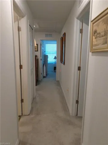 a view of hallway with livingroom