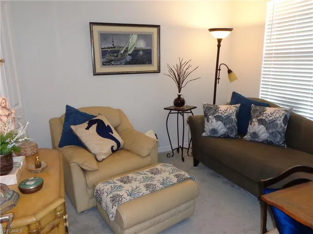 a living room with furniture and a couch