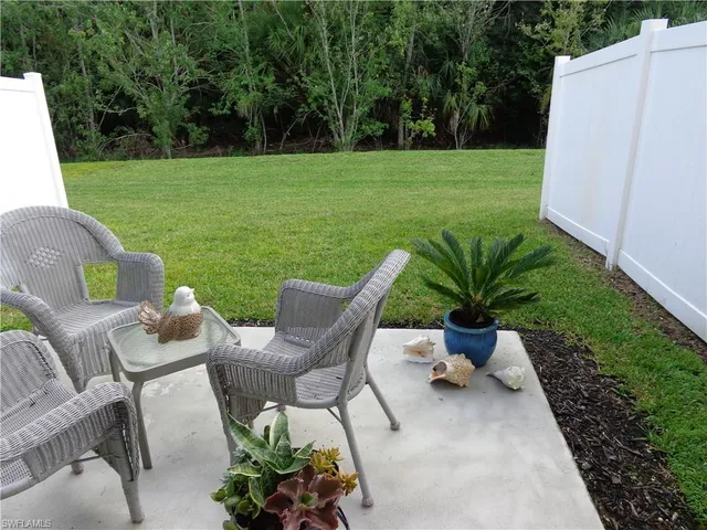 a view of a chairs and table in the garden