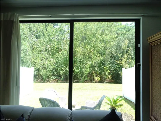 a view of a living room and floor to ceiling window