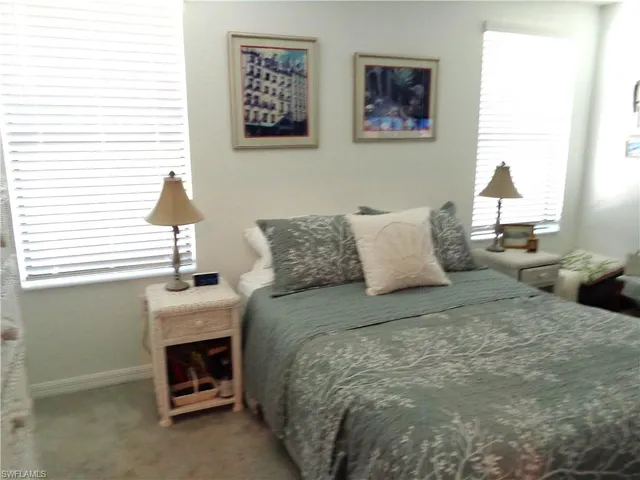 a bedroom with bed and a window