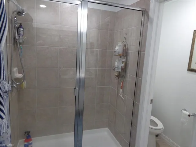 a bathroom with a shower and a toilet