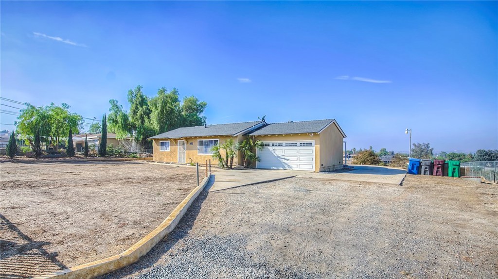 18131 Wood Road Perris, CA 92570 - Photo 1 of 1 a view of a house with a patio