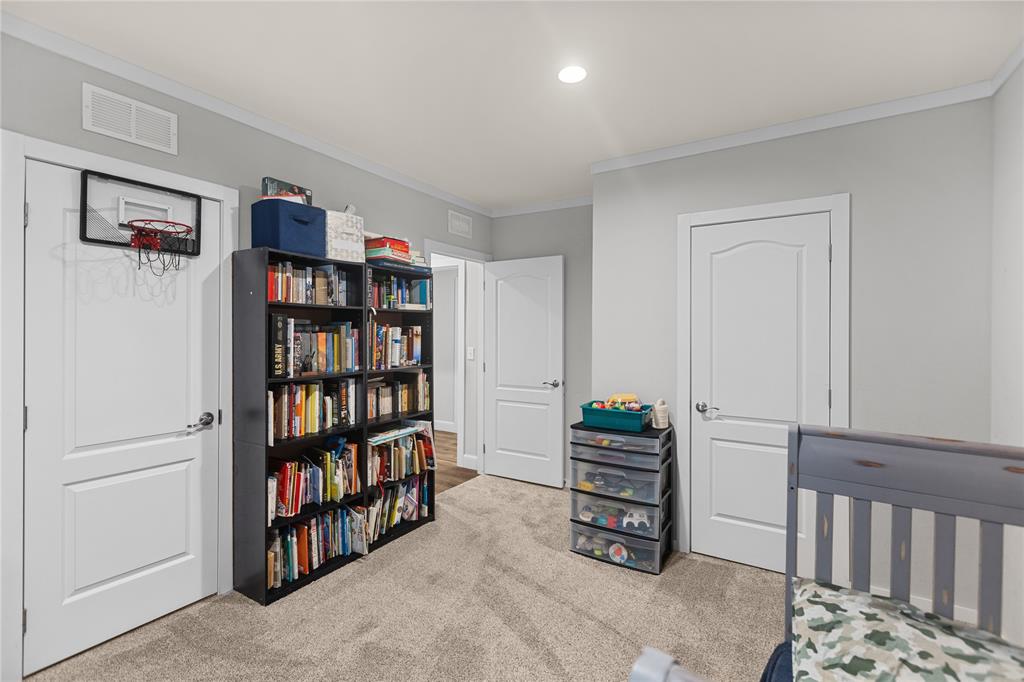 645 VZ County Road Ben Wheeler, TX 75754 - Photo 16 of 38 a room with furniture and a book shelf