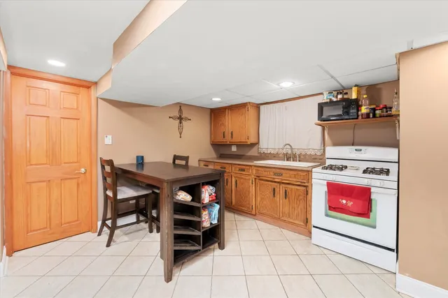 a kitchen with stainless steel appliances granite countertop a sink and cabinets