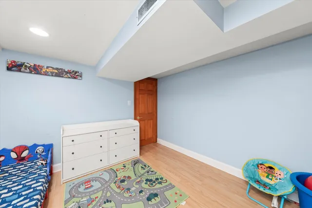 a room with toys and wooden floor
