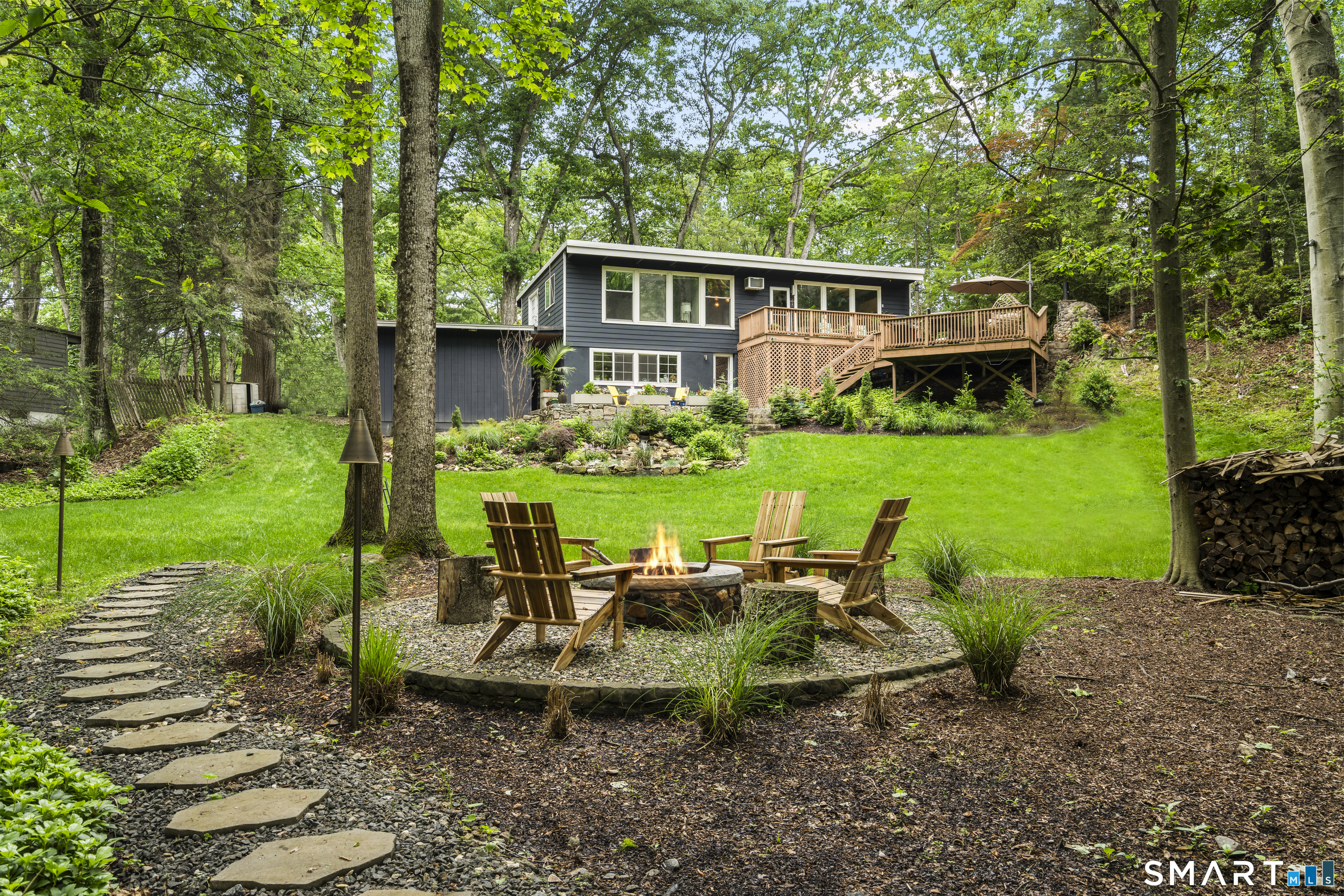 13 Alewives Road Norwalk, CT 06850 - Photo 13 of 40 fire pit view from the river to the house