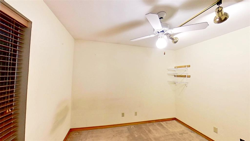 509 Topside Drive Azle, TX 76020 - Photo 12 of 19 a view of a room with rack and fan