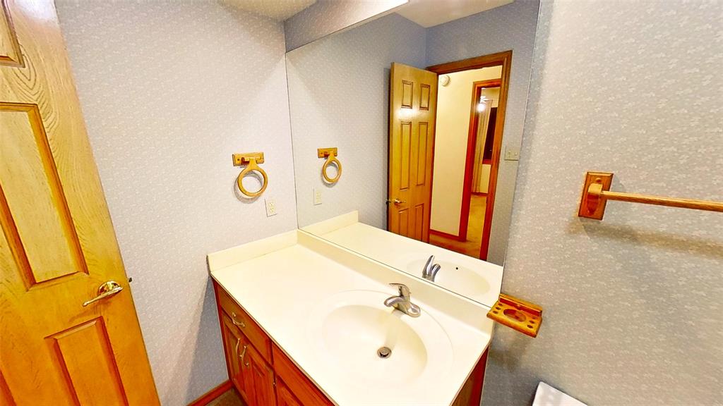 509 Topside Drive Azle, TX 76020 - Photo 15 of 19 a bathroom with a tub sink and mirror