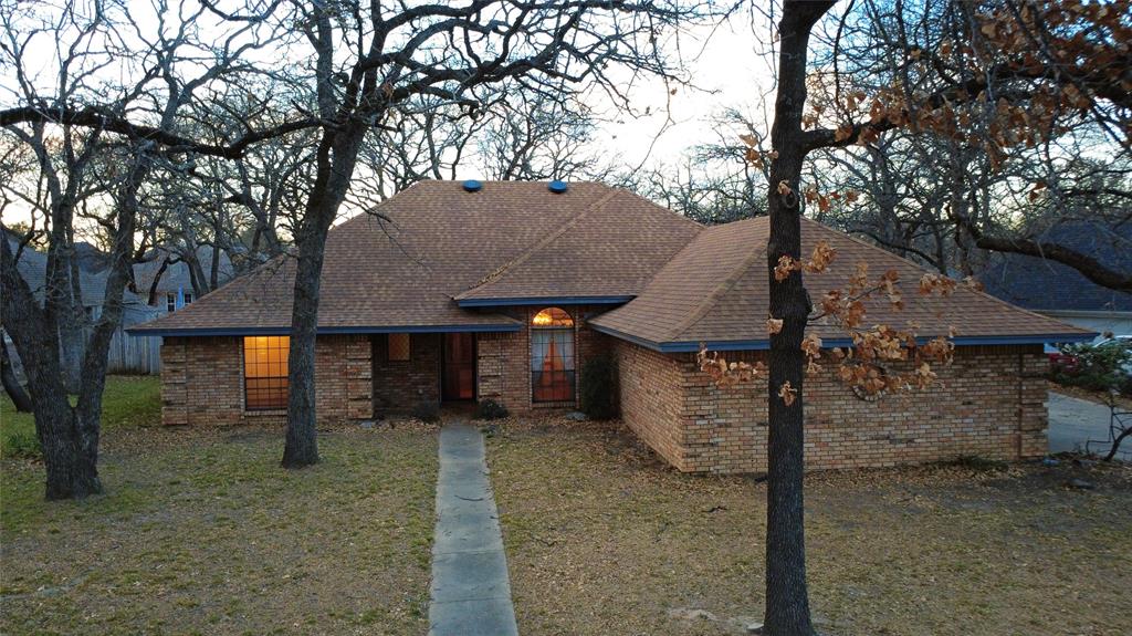 509 Topside Drive Azle, TX 76020 - Photo 3 of 19 a view of a house with a tree and a yard
