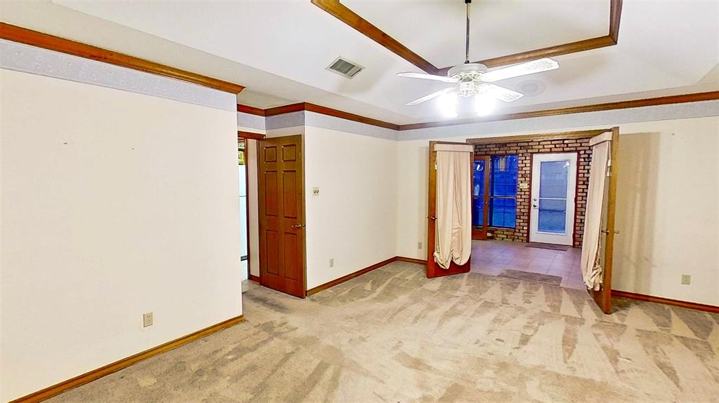 509 Topside Drive Azle, TX 76020 - Photo 10 of 19 a view of a livingroom with wooden floor and a ceiling fan