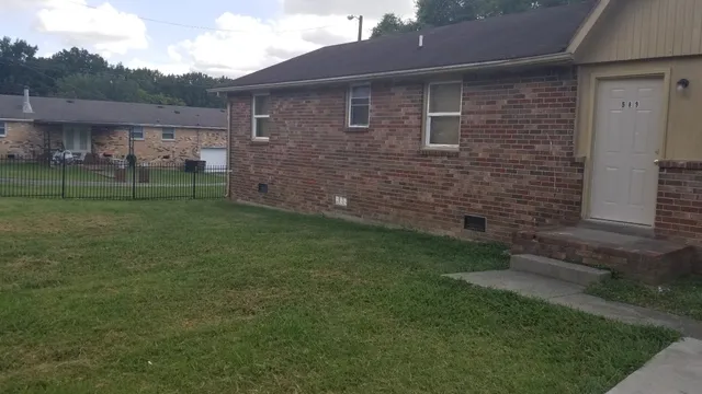a brick house with a yard