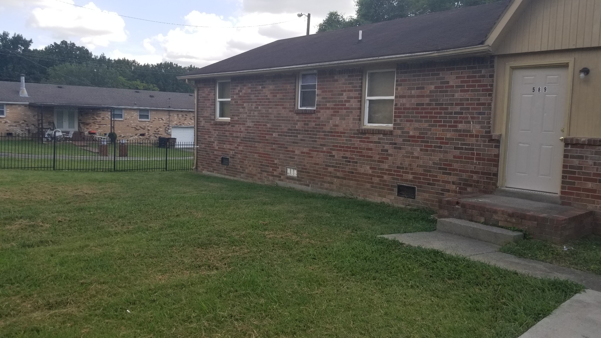 589 Judd Drive Nashville, TN 37218 - Photo 2 of 11 a brick house with a yard