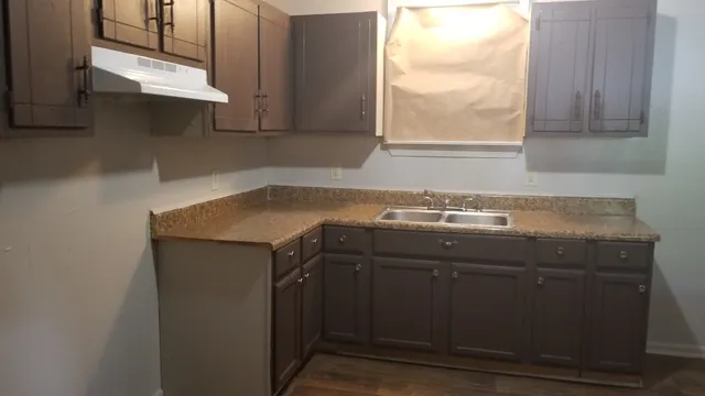 a sink sitting under a window