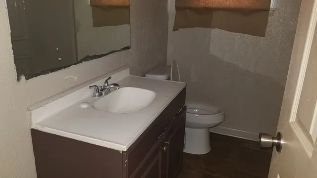 a bathroom with a sink and cabinets