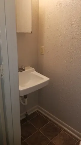 a bathroom with a toilet and sink