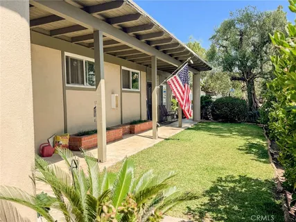 a view of a backyard of the house