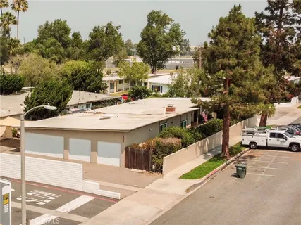a view of a patio with a table and chairs